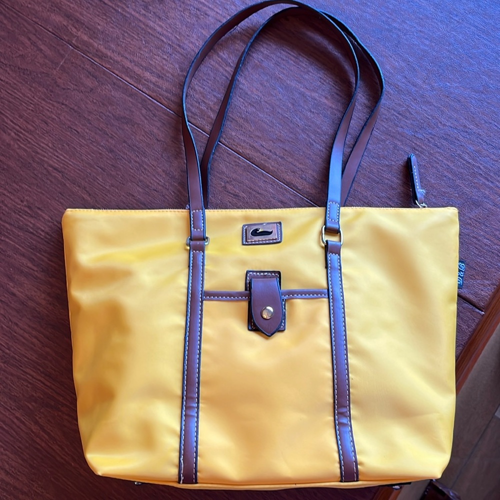Like a Dooney and Bourke Wayfarer yellow nylon, tote, travel bag. Looks new.